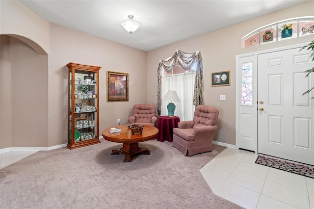 3246 Brenford Pl, Land O Lakes, FL 34638 - foyer entrance with light carpet and arched walkways