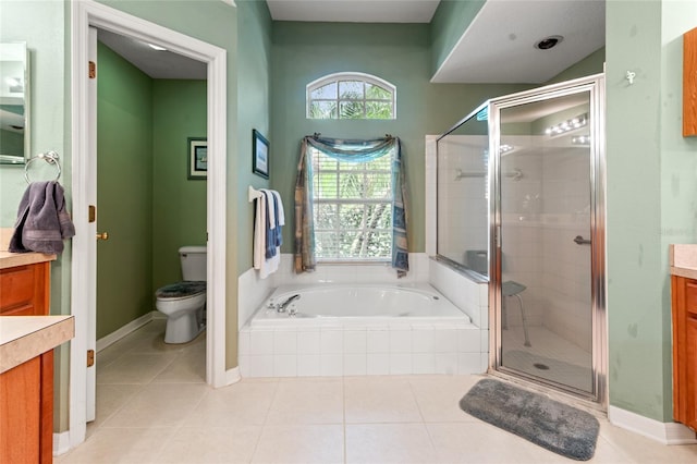 3246 Brenford Pl, Land O Lakes, FL 34638 - bathroom featuring vanity, a garden tub, a stall shower, and tile patterned floors