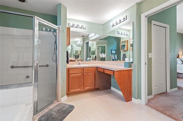 3246 Brenford Pl, Land O Lakes, FL 34638 - ensuite bathroom with a stall shower, vanity, and tile patterned flooring