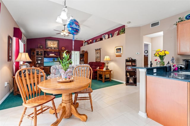 3246 Brenford Pl, Land O Lakes, FL 34638 - dining space with ceiling fan, light colored carpet, vaulted ceiling, and light tile patterned flooring