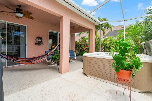 3246 Brenford Pl, Land O Lakes, FL 34638 - view of patio featuring a hot tub, a ceiling fan, and a lanai