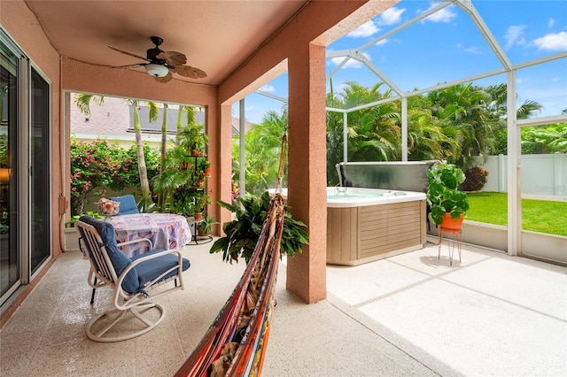 3246 Brenford Pl, Land O Lakes, FL 34638 - sunroom featuring a jacuzzi and a ceiling fan