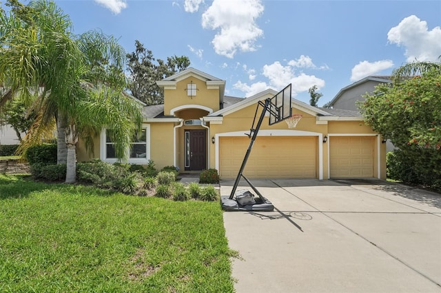 6706 Riverside Bluffs Dr, Riverview, FL 33578 - view of front facade with stucco siding, a garage, concrete driveway, and a front lawn