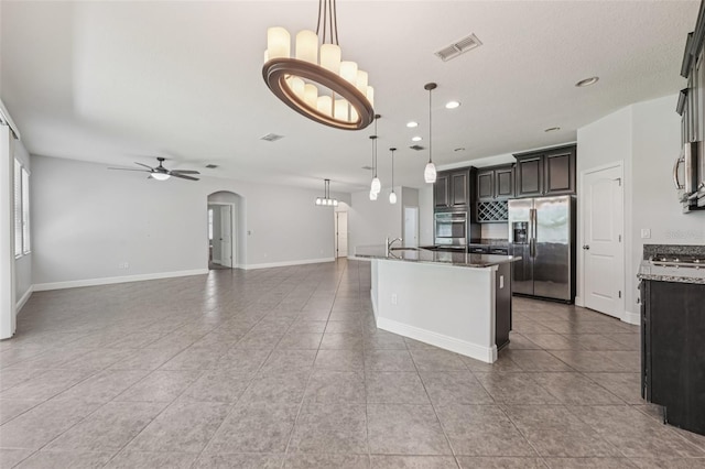 6706 Riverside Bluffs Dr, Riverview, FL 33578 - kitchen featuring stainless steel appliances, open floor plan, recessed lighting, and tile patterned flooring