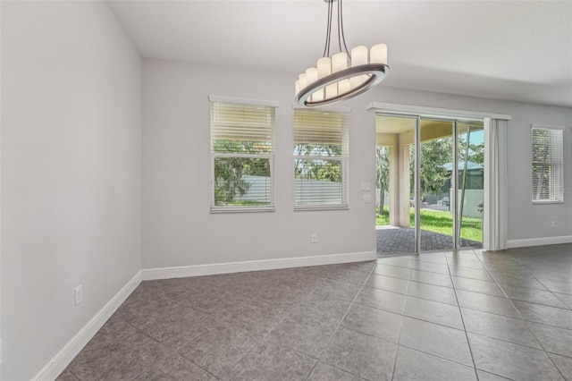 6706 Riverside Bluffs Dr, Riverview, FL 33578 - spare room with tile patterned flooring and a chandelier