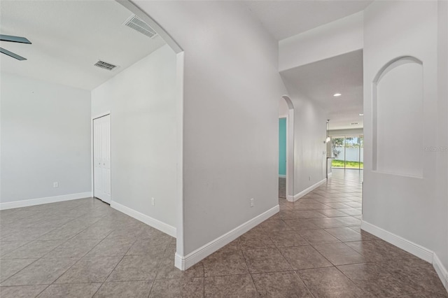 6706 Riverside Bluffs Dr, Riverview, FL 33578 - hall featuring arched walkways, tile patterned flooring, and recessed lighting