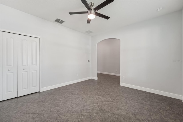 6706 Riverside Bluffs Dr, Riverview, FL 33578 - unfurnished bedroom featuring arched walkways, a closet, and ceiling fan