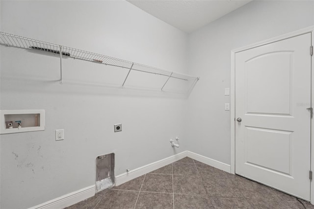 6706 Riverside Bluffs Dr, Riverview, FL 33578 - laundry area with gas dryer hookup, electric dryer hookup, washer hookup, and tile patterned floors