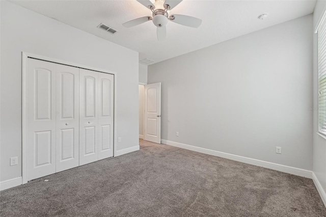 6706 Riverside Bluffs Dr, Riverview, FL 33578 - unfurnished bedroom with carpet, a closet, and ceiling fan