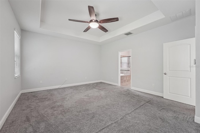 6706 Riverside Bluffs Dr, Riverview, FL 33578 - carpeted spare room with a raised ceiling and a ceiling fan