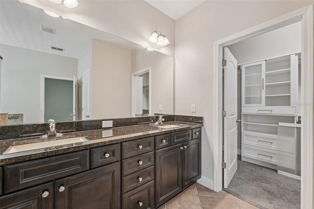 6706 Riverside Bluffs Dr, Riverview, FL 33578 - full bathroom featuring double vanity, tile patterned floors, and a spacious closet