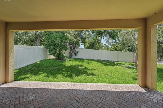 6706 Riverside Bluffs Dr, Riverview, FL 33578 - fenced backyard with a patio area