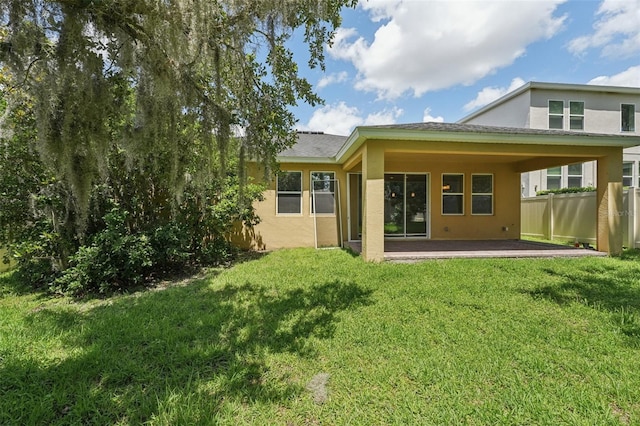 6706 Riverside Bluffs Dr, Riverview, FL 33578 - back of property featuring stucco siding and a patio