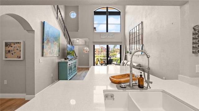 2741 Via Cipriani Unit 916A, Clearwater, FL 33764 - foyer with wood finished floors, plenty of natural light, arched walkways, and a textured wall