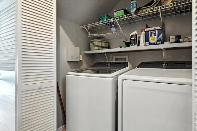 2741 Via Cipriani Unit 916A, Clearwater, FL 33764 - laundry area with washing machine and clothes dryer