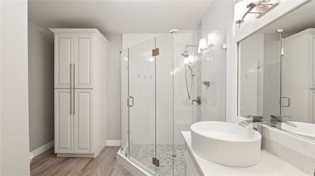 2741 Via Cipriani Unit 916A, Clearwater, FL 33764 - full bath with a stall shower, vanity, and wood finished floors