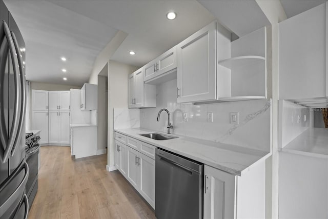 3956 Versailles Dr, Tampa, FL 33634 - kitchen featuring appliances with stainless steel finishes, open shelves, recessed lighting, decorative backsplash, and white cabinetry