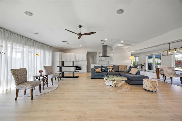 3956 Versailles Dr, Tampa, FL 33634 - living area featuring ceiling fan, light wood-style flooring, lofted ceiling, and recessed lighting