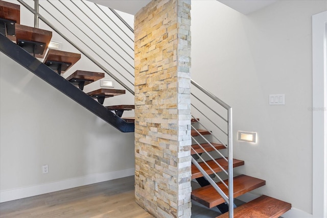 3956 Versailles Dr, Tampa, FL 33634 - stairs featuring wood finished floors and baseboards