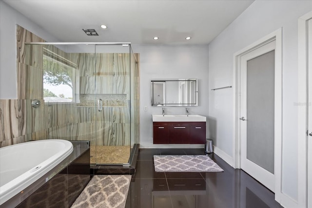 3956 Versailles Dr, Tampa, FL 33634 - bathroom with a bath, double vanity, a shower stall, recessed lighting, and tile patterned flooring