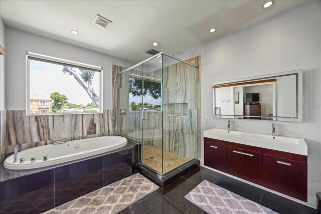 3956 Versailles Dr, Tampa, FL 33634 - bathroom with a whirlpool tub, a shower stall, double vanity, and recessed lighting