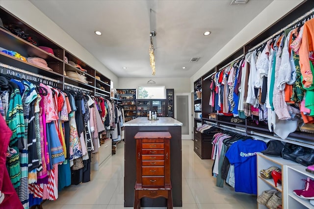 3956 Versailles Dr, Tampa, FL 33634 - walk in closet with light tile patterned floors