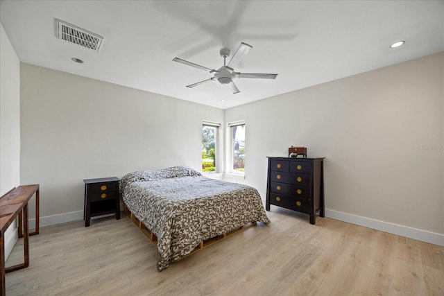 3956 Versailles Dr, Tampa, FL 33634 - bedroom with light wood finished floors, a ceiling fan, and recessed lighting