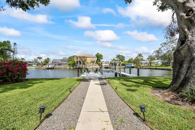 3956 Versailles Dr, Tampa, FL 33634 - dock with a water view, a lawn, and a residential view