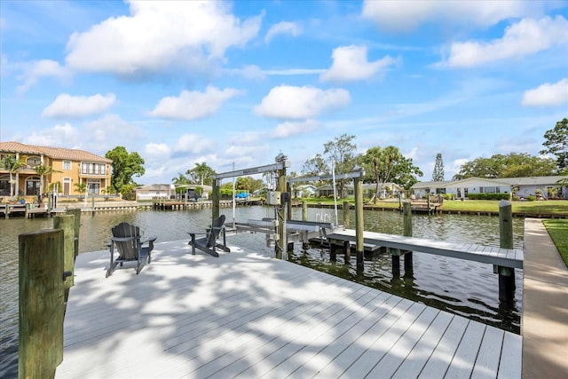 3956 Versailles Dr, Tampa, FL 33634 - dock area featuring a water view, boat lift, and a residential view
