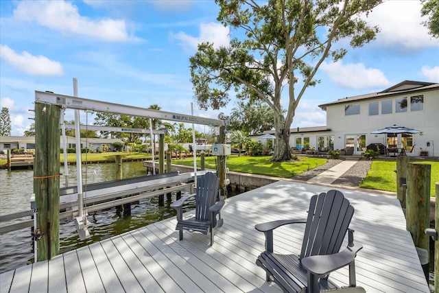 3956 Versailles Dr, Tampa, FL 33634 - dock area featuring boat lift, a water view, and a yard