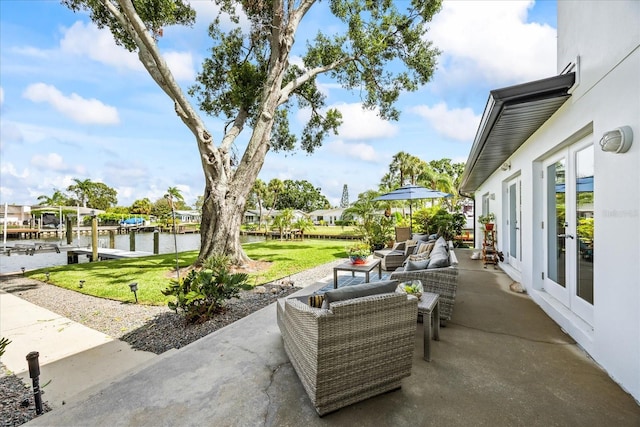 3956 Versailles Dr, Tampa, FL 33634 - view of patio / terrace with french doors, an outdoor living space, a water view, and a boat dock
