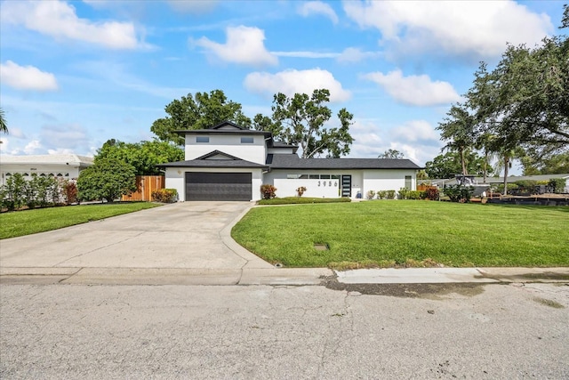 3956 Versailles Dr, Tampa, FL 33634 - view of front of home with stucco siding, concrete driveway, and a garage