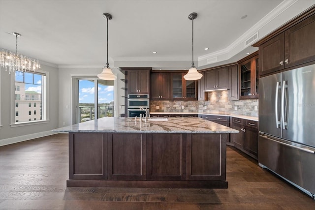 125 Belleview Blvd Unit 503, Belleair, FL 33756 - kitchen with appliances with stainless steel finishes, dark wood finished floors, dark brown cabinets, backsplash, and glass insert cabinets