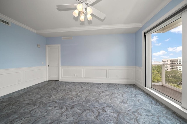 125 Belleview Blvd Unit 503, Belleair, FL 33756 - carpeted empty room featuring ornamental molding, a ceiling fan, and wainscoting