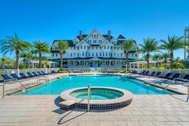 125 Belleview Blvd Unit 503, Belleair, FL 33756 - community pool featuring a hot tub, a patio, and a pergola