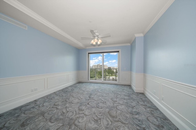 125 Belleview Blvd Unit 503, Belleair, FL 33756 - carpeted spare room with ornamental molding, a wainscoted wall, a decorative wall, and a ceiling fan