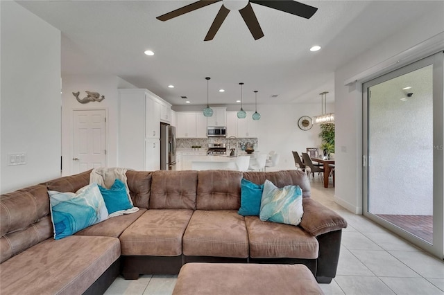 5611 Del Coronado Dr, Apollo Beach, FL 33572 - living area featuring ceiling fan, light tile patterned floors, recessed lighting, and a chandelier