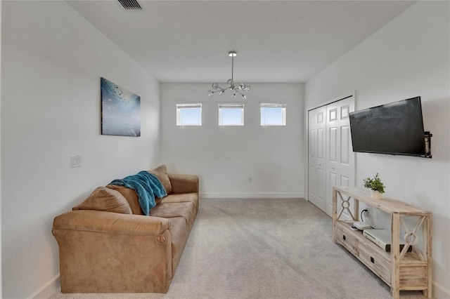 5611 Del Coronado Dr, Apollo Beach, FL 33572 - living room with a chandelier and light colored carpet