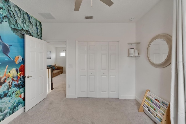 5611 Del Coronado Dr, Apollo Beach, FL 33572 - carpeted bedroom with a ceiling fan and a closet
