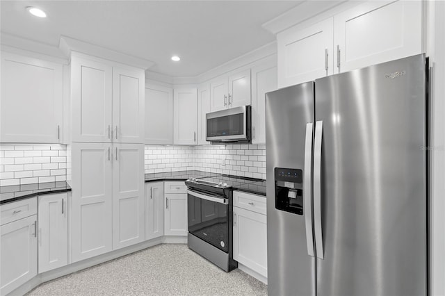 358 Highland Shores Dr, Ellenton, FL 34222 - kitchen with stainless steel appliances, dark countertops, recessed lighting, white cabinetry, and backsplash