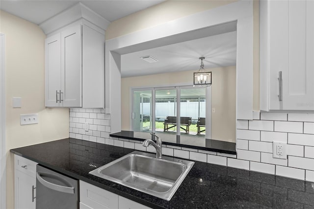 358 Highland Shores Dr, Ellenton, FL 34222 - kitchen with stainless steel dishwasher, white cabinetry, tasteful backsplash, a chandelier, and pendant lighting