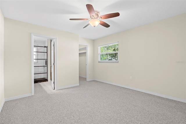 358 Highland Shores Dr, Ellenton, FL 34222 - unfurnished bedroom featuring carpet flooring, a spacious closet, a ceiling fan, and a closet