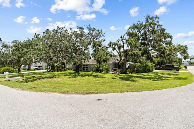 358 Highland Shores Dr, Ellenton, FL 34222 - obstructed view of property with a front lawn