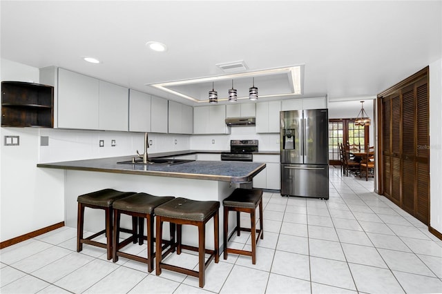 11203 Egret Nest Ct, Riverview, FL 33569 - kitchen featuring stainless steel fridge with ice dispenser, electric stove, under cabinet range hood, dark countertops, and recessed lighting