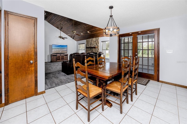 11203 Egret Nest Ct, Riverview, FL 33569 - dining space featuring lofted ceiling, light tile patterned floors, a ceiling fan, french doors, and a chandelier