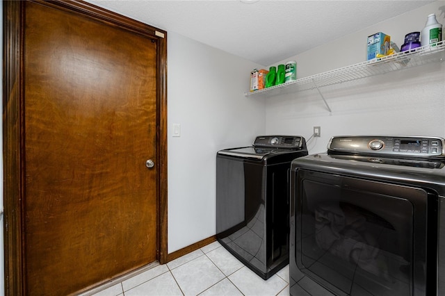 11203 Egret Nest Ct, Riverview, FL 33569 - laundry area featuring separate washer and dryer and light tile patterned floors