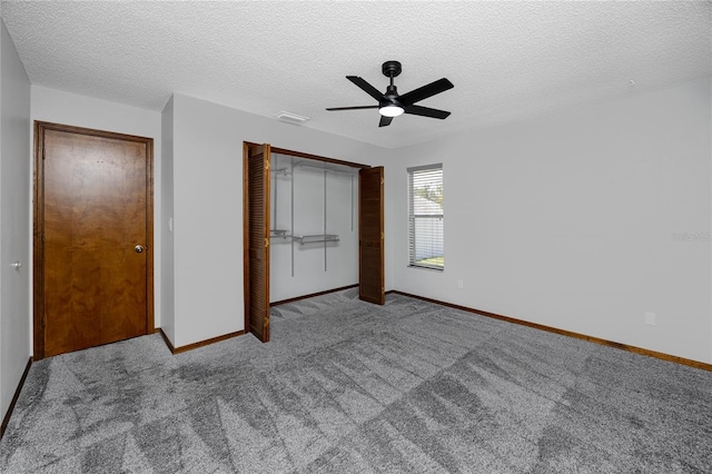 11203 Egret Nest Ct, Riverview, FL 33569 - unfurnished bedroom with carpet flooring, a closet, a textured ceiling, and ceiling fan