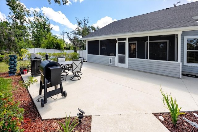11203 Egret Nest Ct, Riverview, FL 33569 - view of patio featuring a sunroom, a grill, and outdoor dining area