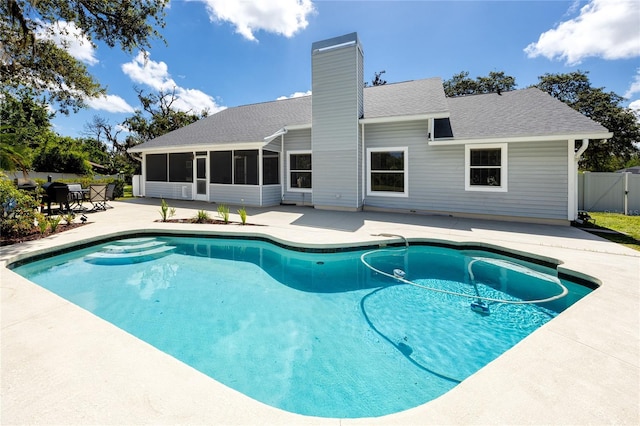 11203 Egret Nest Ct, Riverview, FL 33569 - view of swimming pool with a patio area and a sunroom