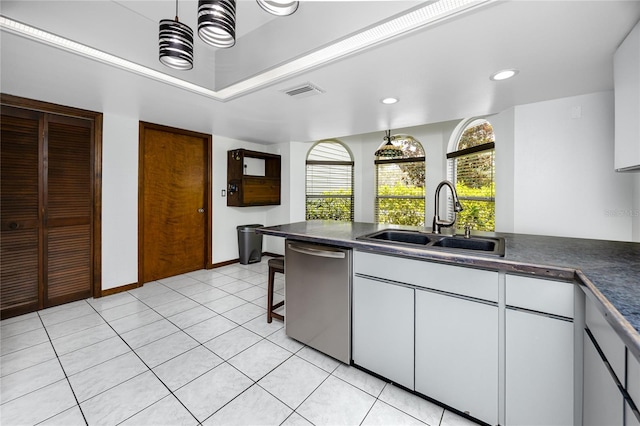 11203 Egret Nest Ct, Riverview, FL 33569 - kitchen featuring dishwasher, dark countertops, white cabinetry, pendant lighting, and recessed lighting